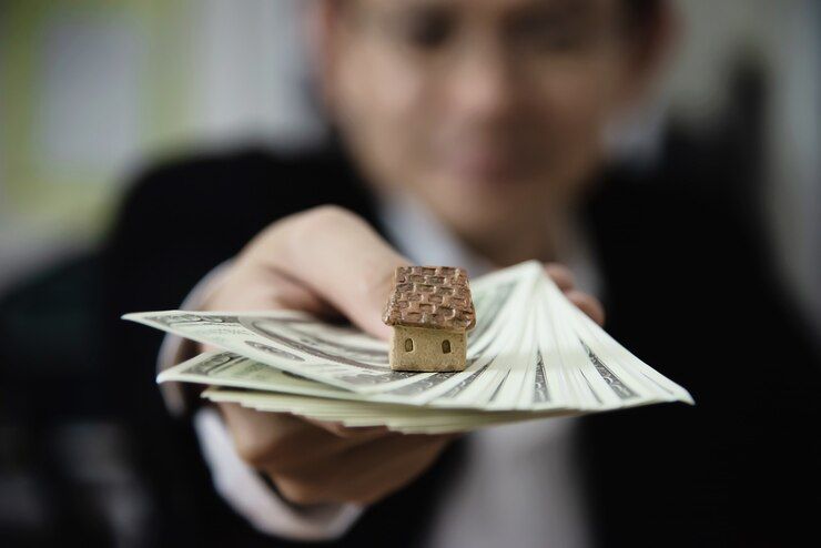 business-man-show-money-bank-note-make-financial-plan-invite-people-buy-house.jpg