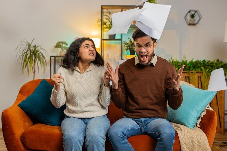 stressed-indian-family-looking-unpaid-bank-debt-bills-doing-paperwork-throws-home-paper-bills_191803-3326.jpg